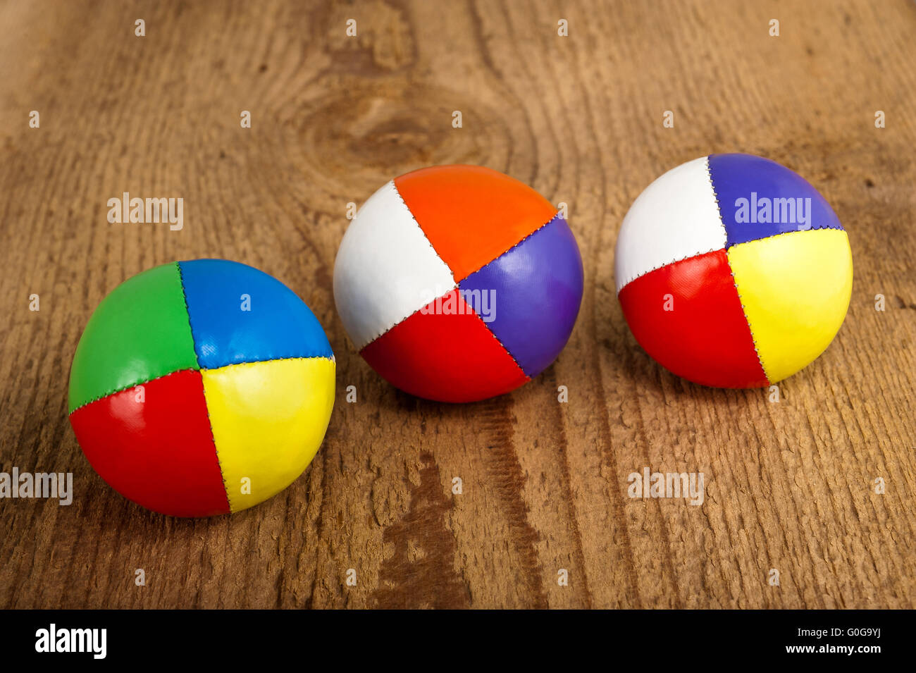 Colored balls on wood background Stock Photo
