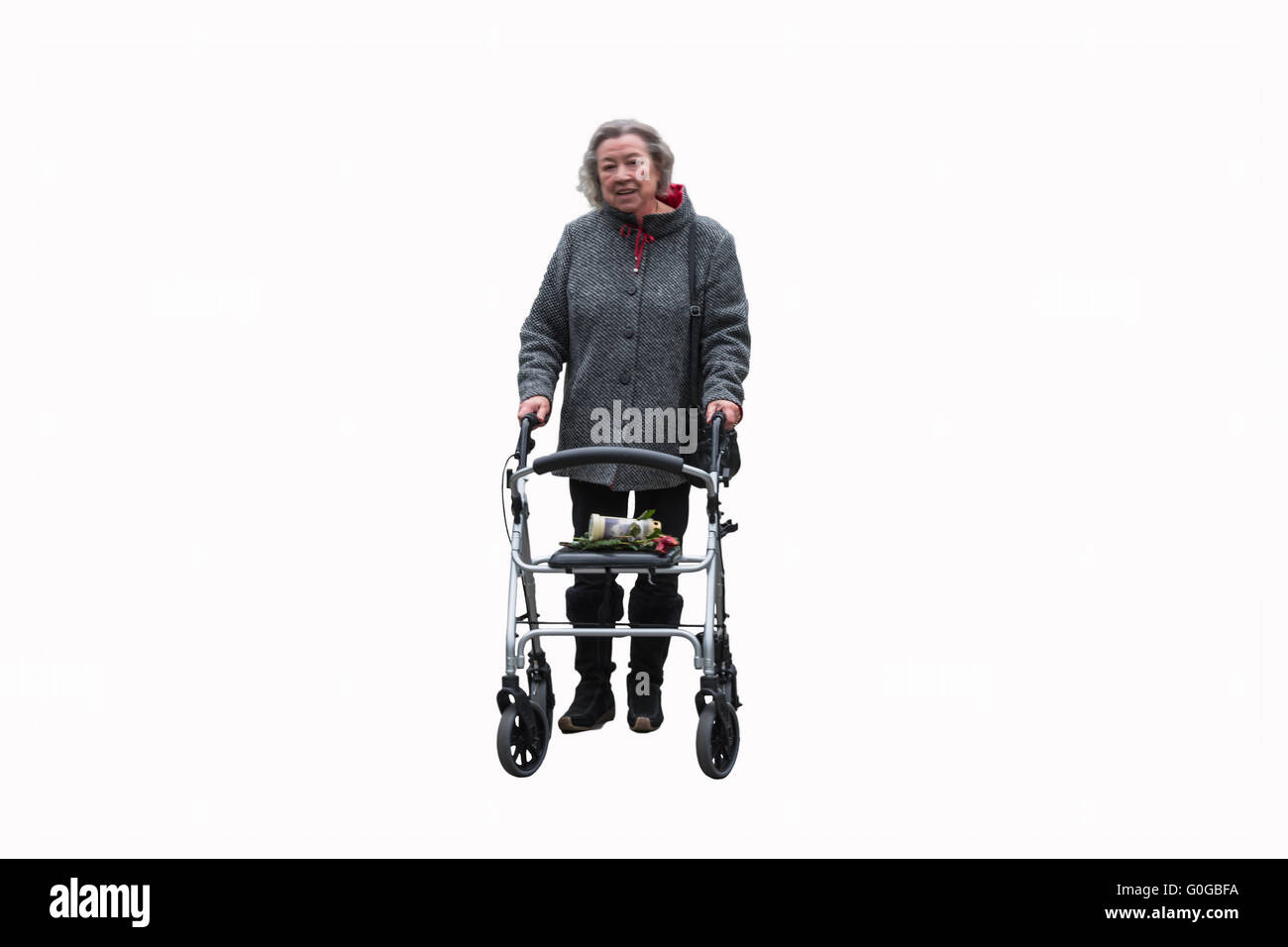 Elderly lady with a walker Stock Photo
