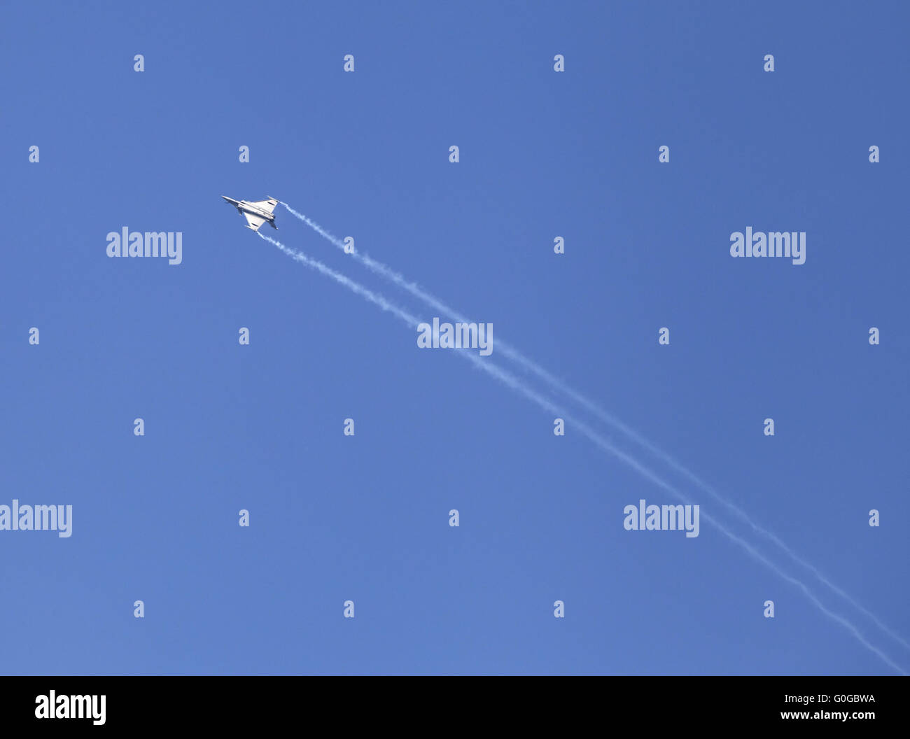 Plane on an air show against blue sky Stock Photo - Alamy