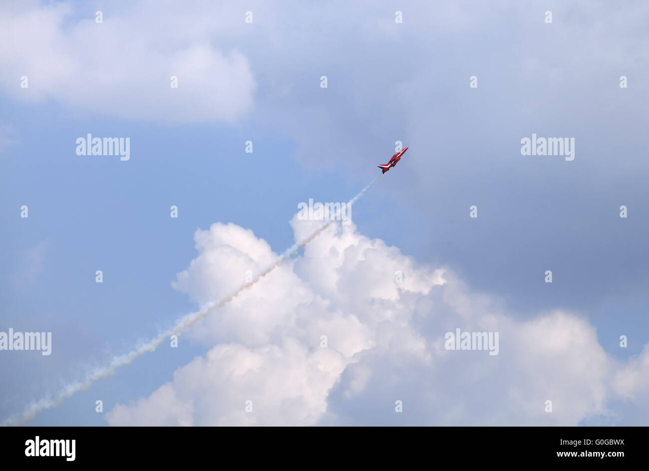 Plane on an air show against blue sky Stock Photo - Alamy