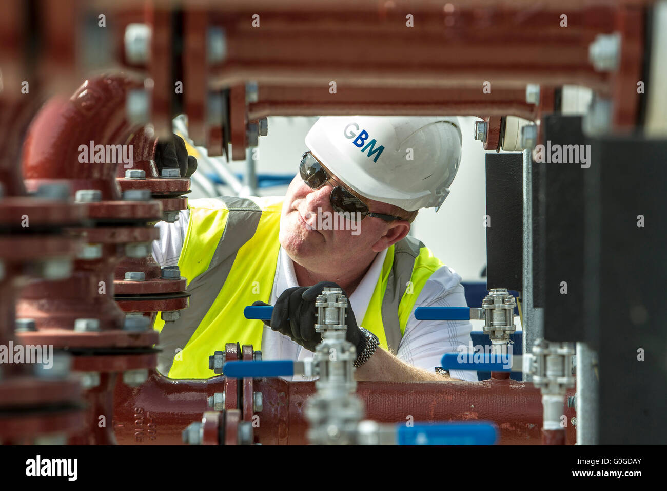 pipes and valves in waste water treatment plant London Stock Photo