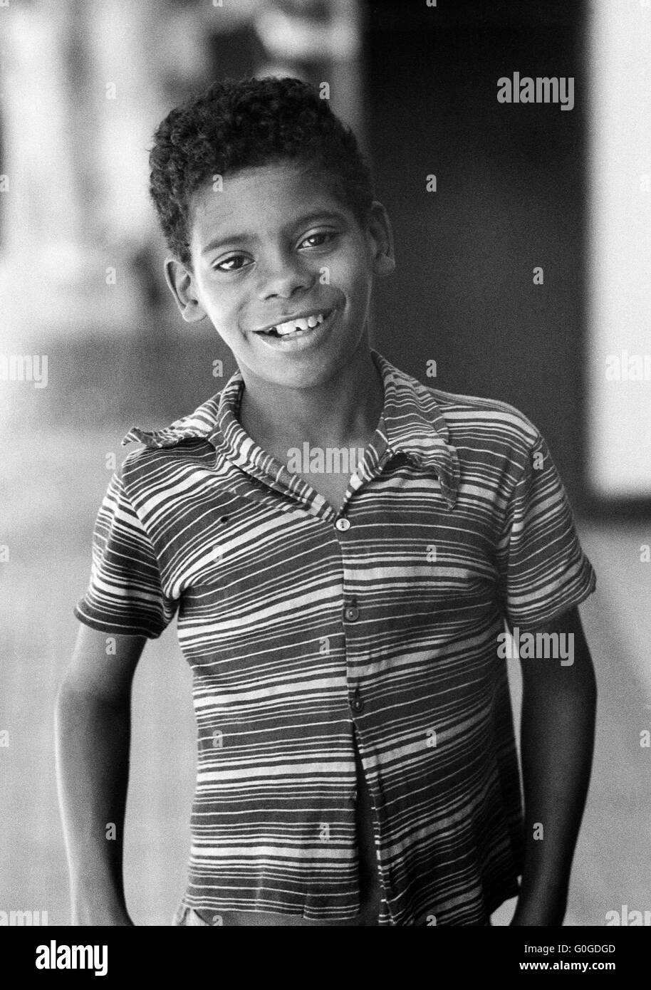 Seventies, black and white photo, people, boy 12 to 15 years, Brazilian, mulatto, short-haired, smiling, T-shirt Stock Photo