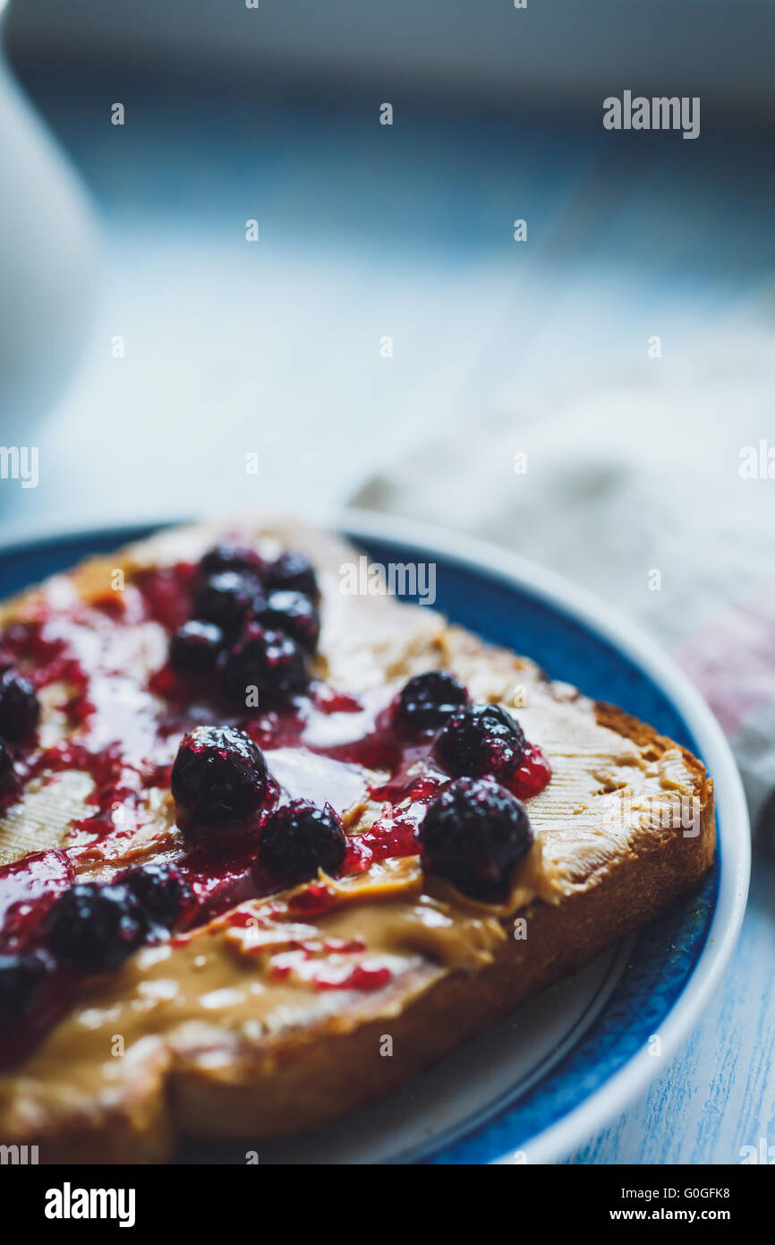 Sandwich with peanut butter and black currant jam Stock Photo