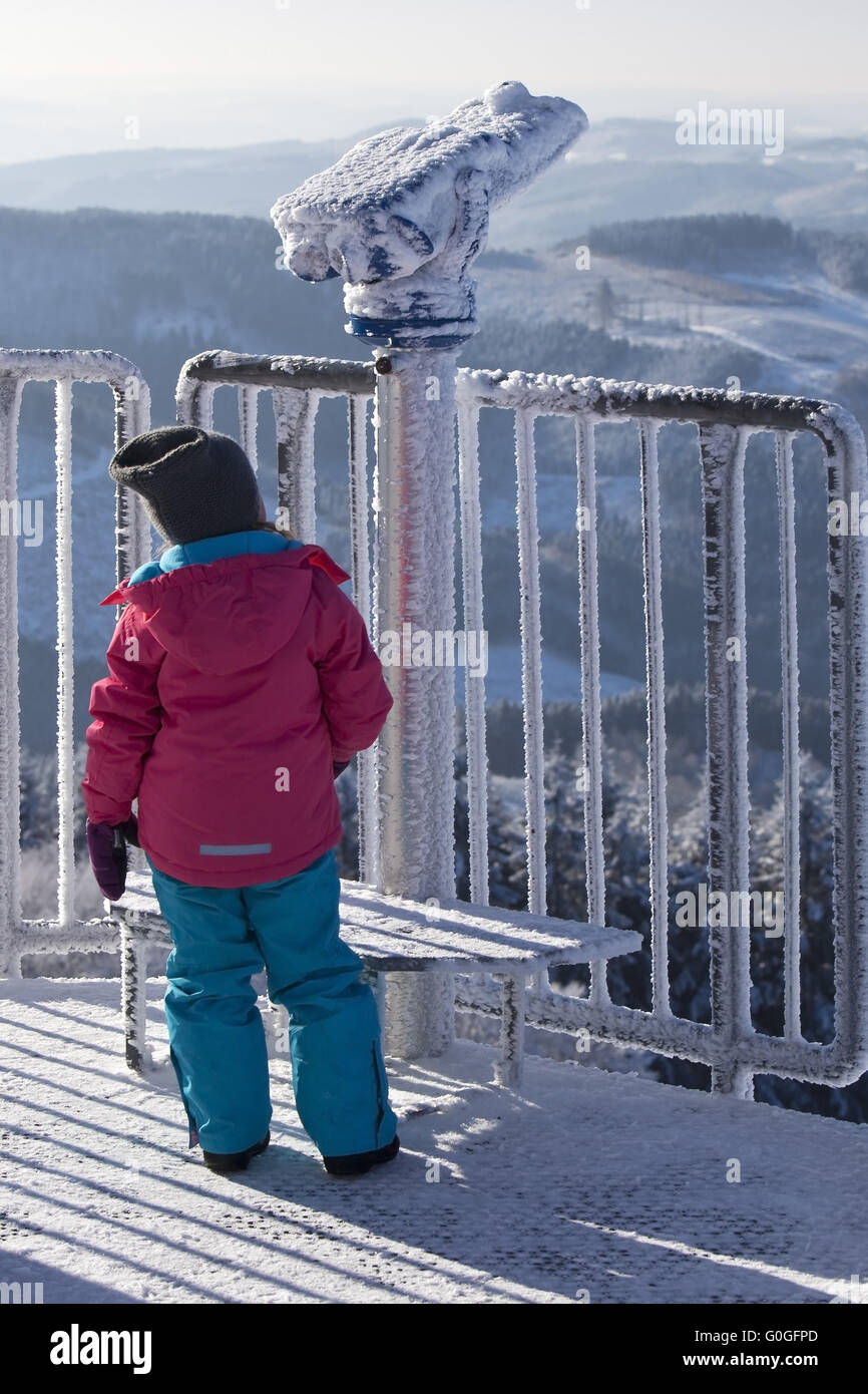 children at frozen coin telescope on Schomberg tower, Germany, North