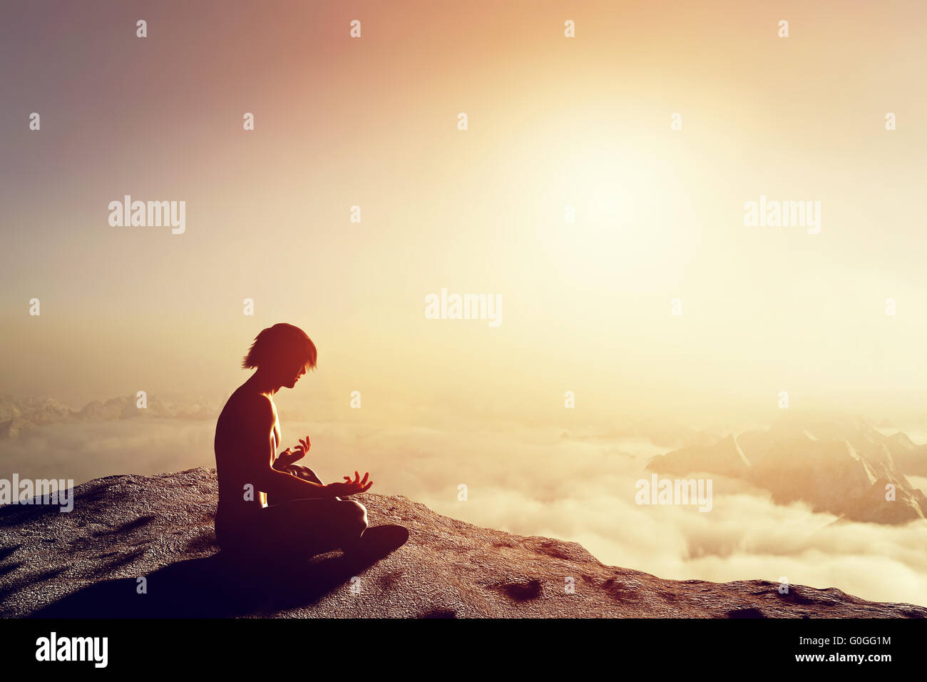 Asian man meditates in yoga position in high mountains above clouds at sunset. Unique concept of meditation Stock Photo