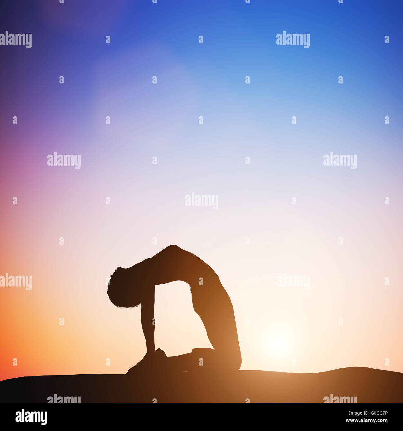 Woman in camel yoga pose meditating at sunset. Zen Stock Photo
