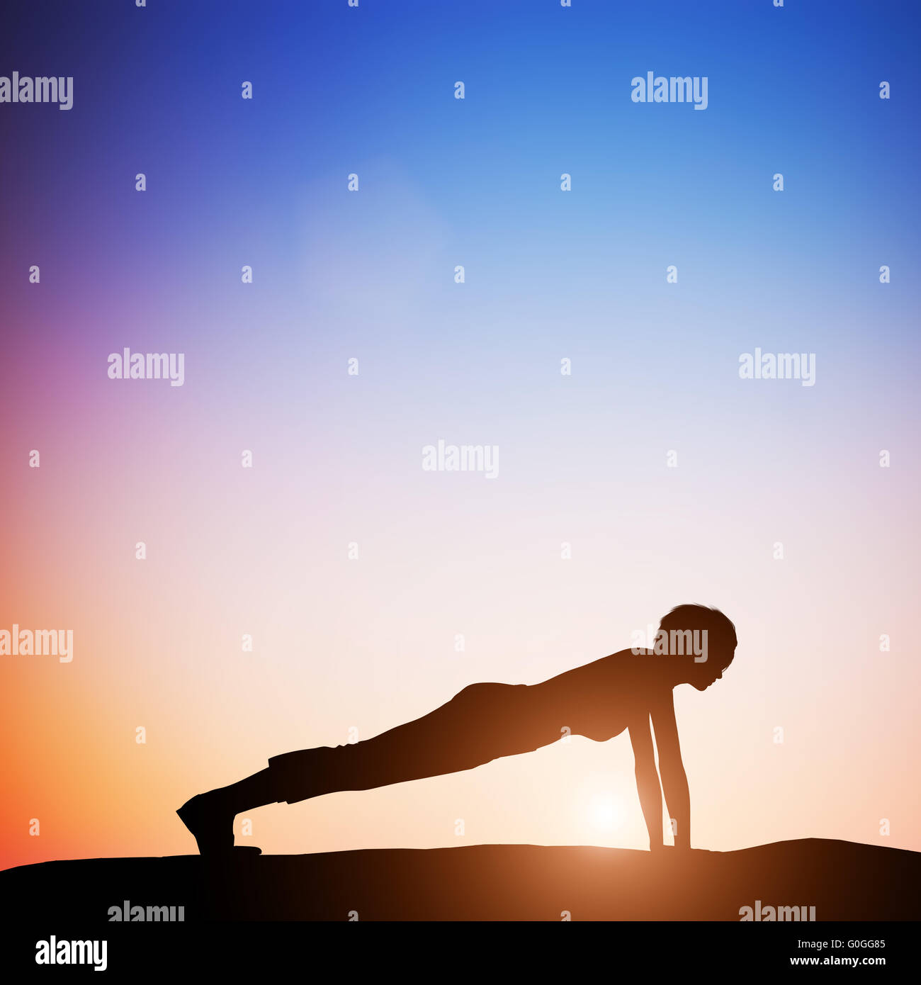 Woman in plank yoga pose meditating at sunset. Zen Stock Photo