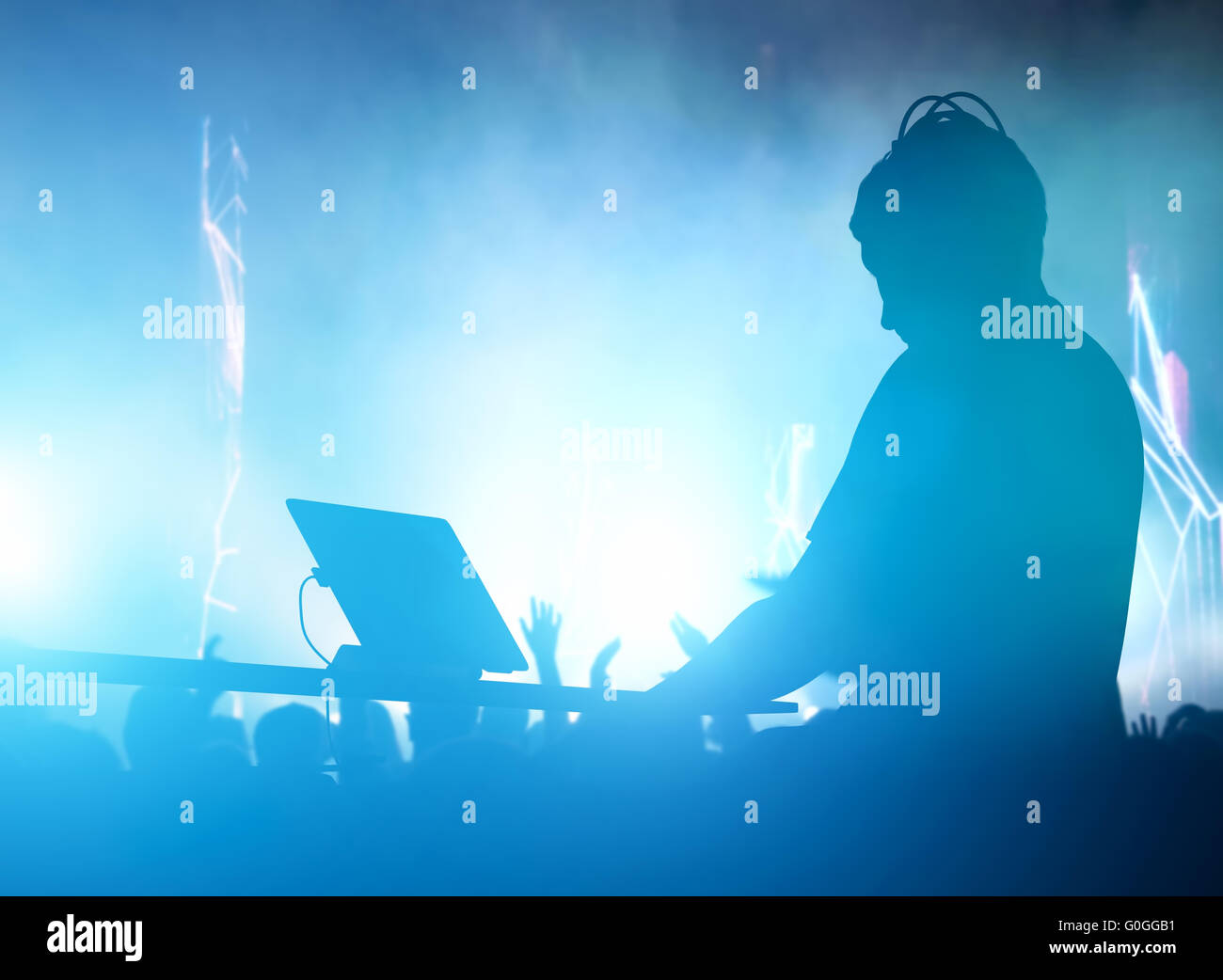 Club, disco DJ playing and mixing music for people. Nightlife Stock Photo