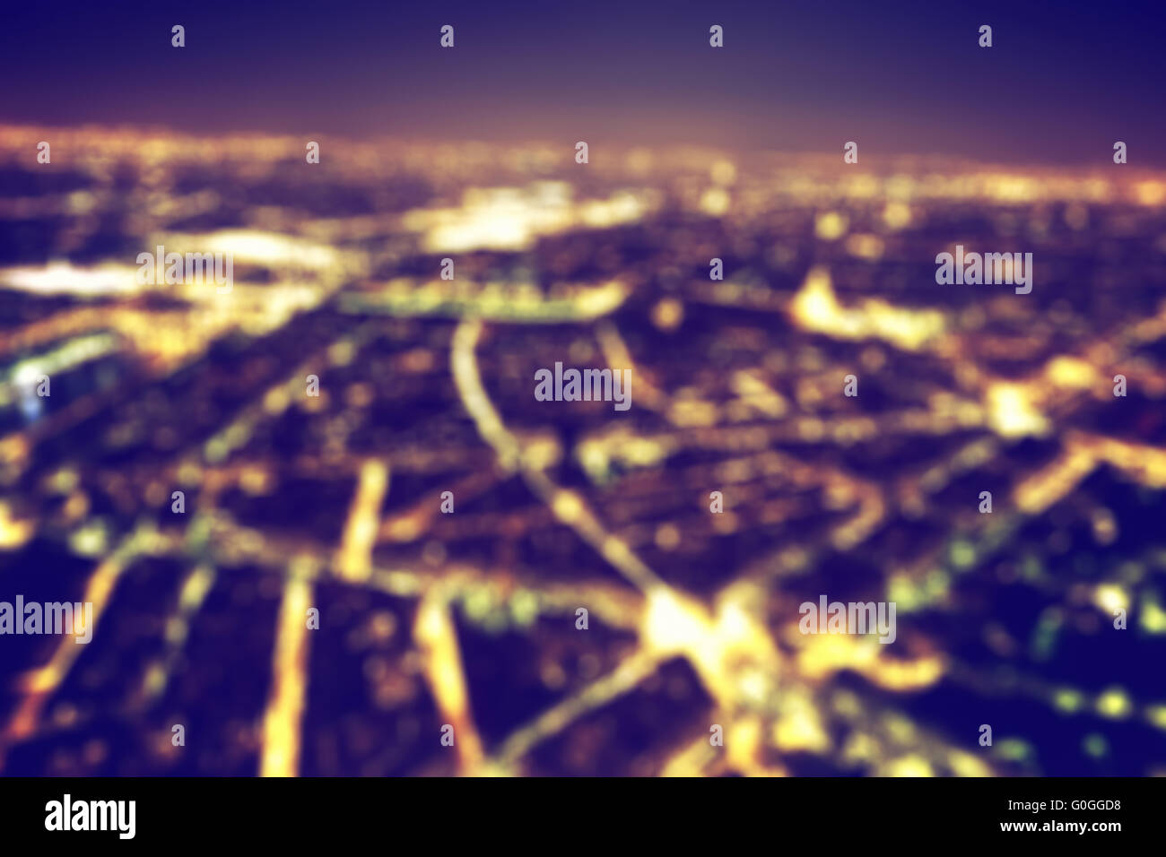 Big city night lights bokeh, blurred background. Vintage Stock Photo