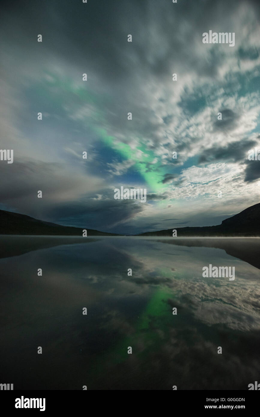 Northern Lights and moonlight over lake Abeskojavri - Abiskojaure, Kungsleden trail, Lapland, Sweden Stock Photo