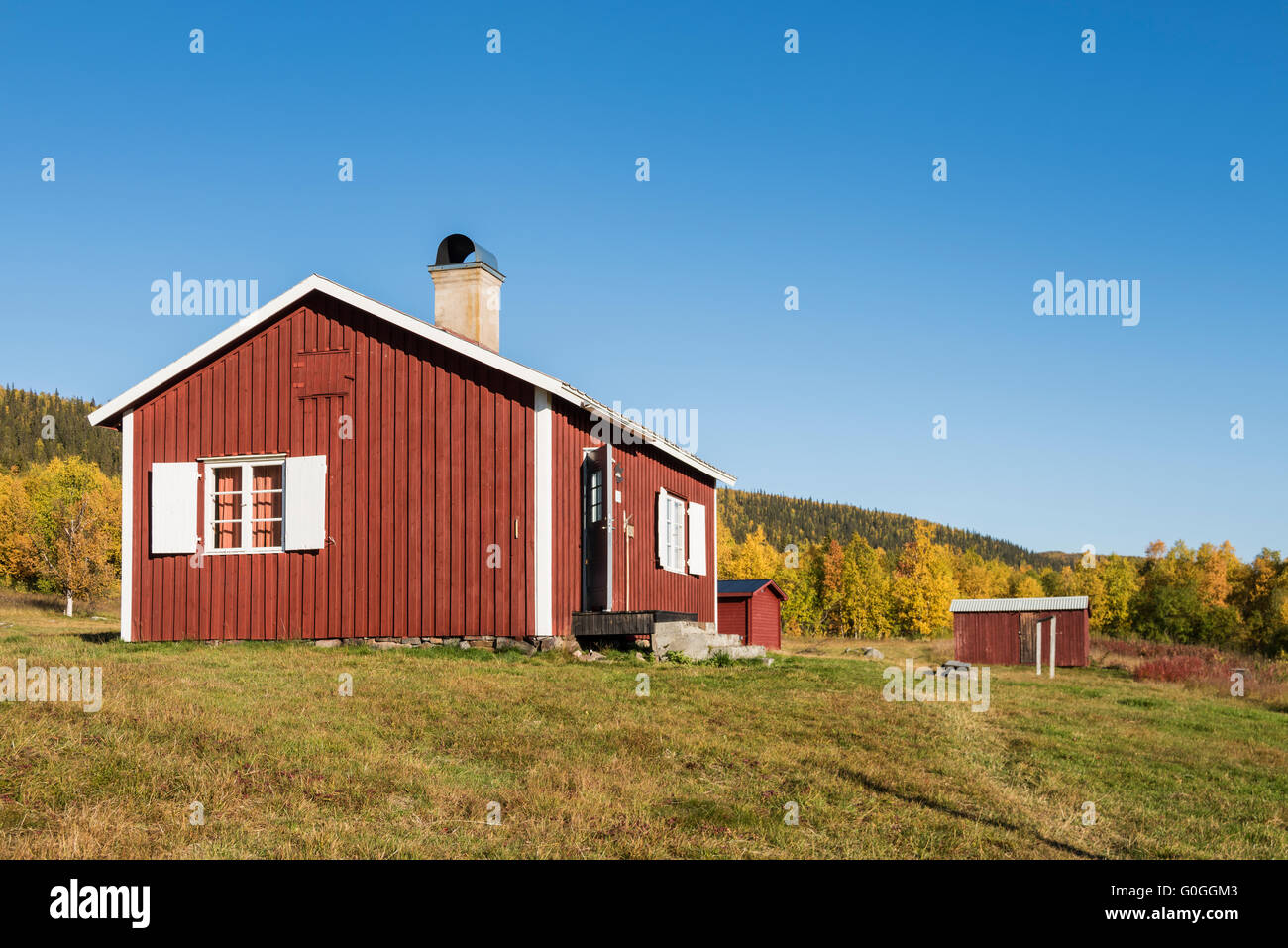 Mountain cabins surrounded by autumn birch forest, near STF Aktse hut, Kungsleden trail, Lapland, Sweden Stock Photo