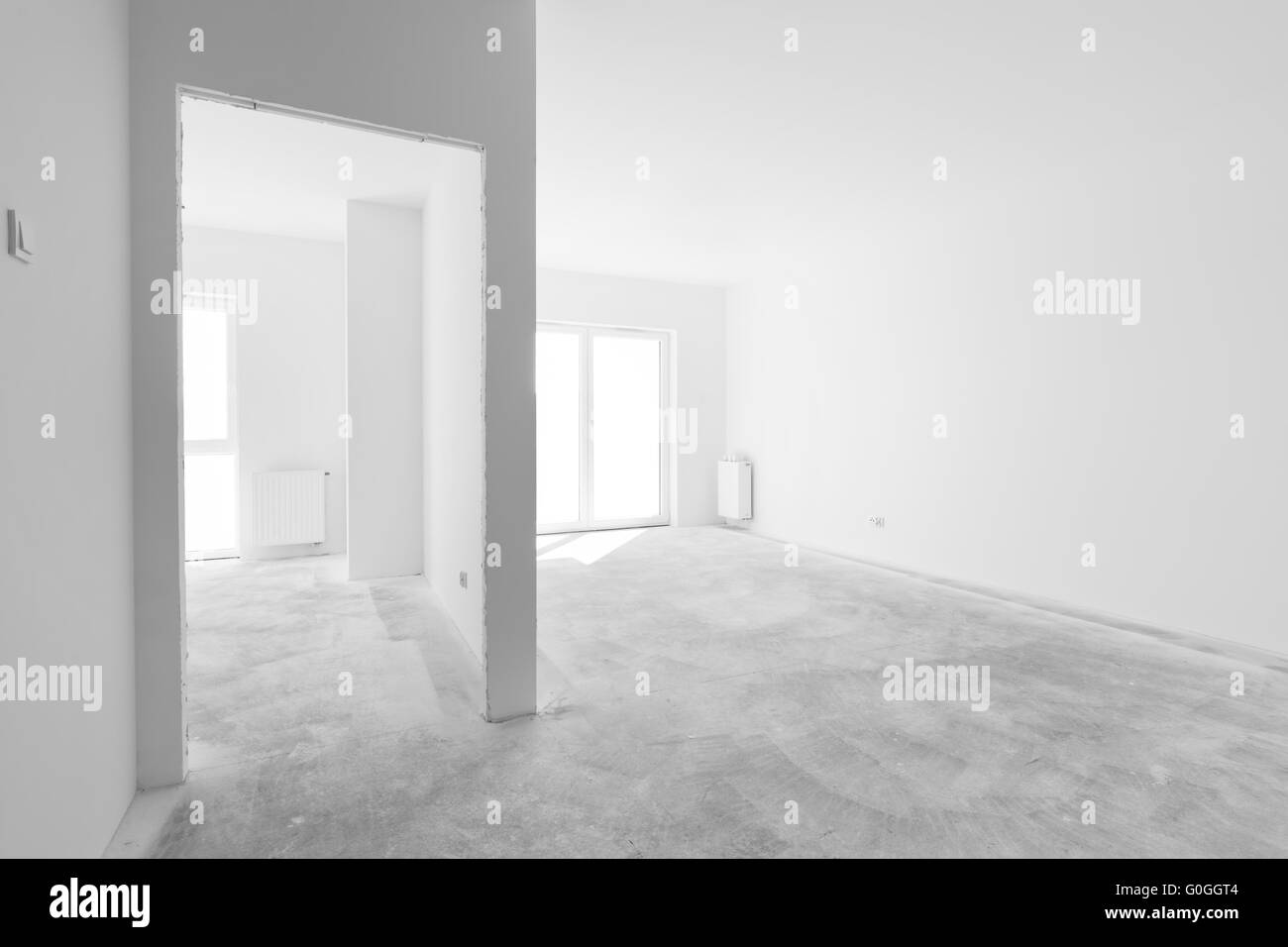 Empty new apartment for interior arrangement. Windows light Stock Photo