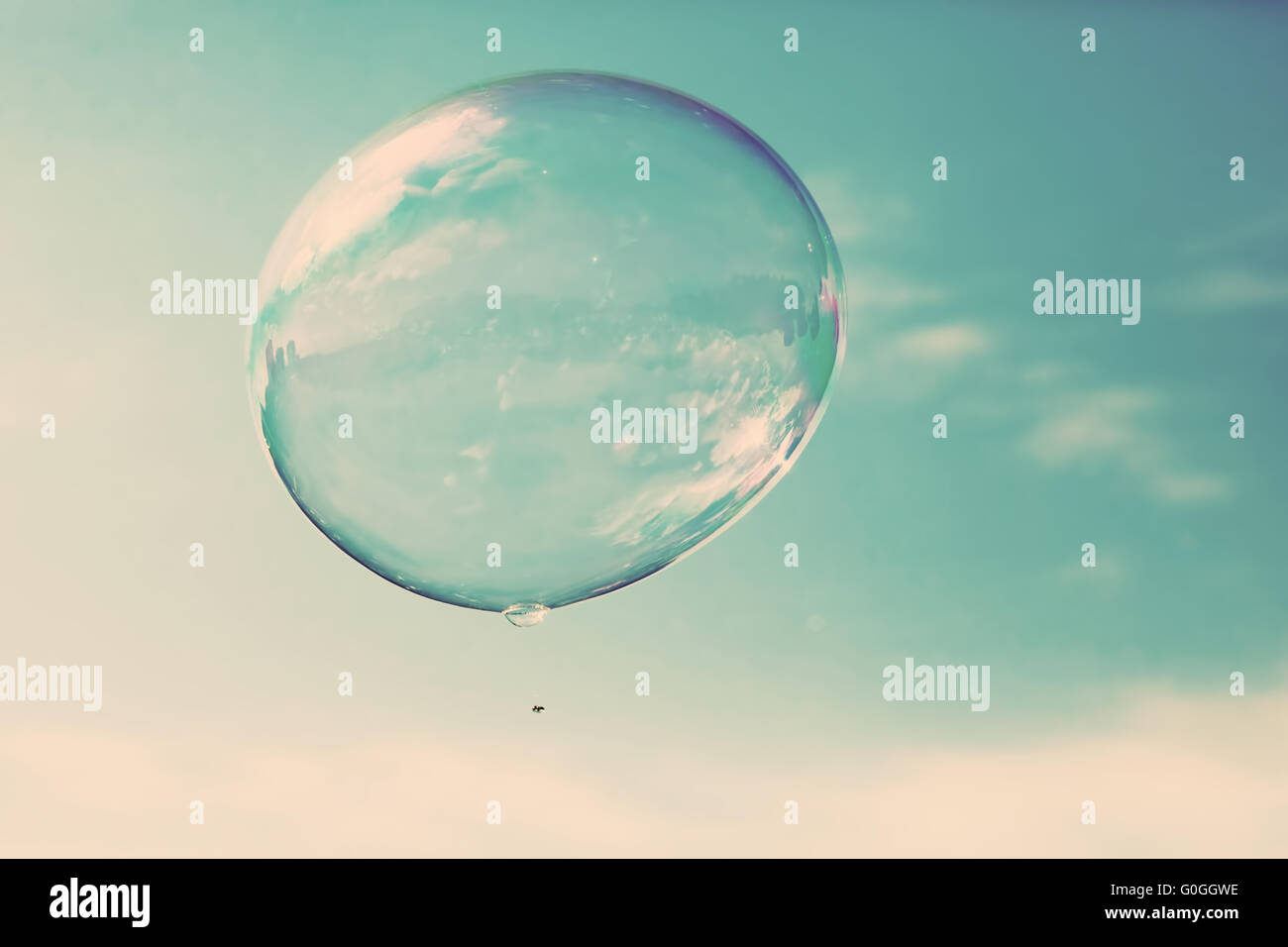 One clean soap bubble flying in the air, blue sky. Vintage Stock Photo ...