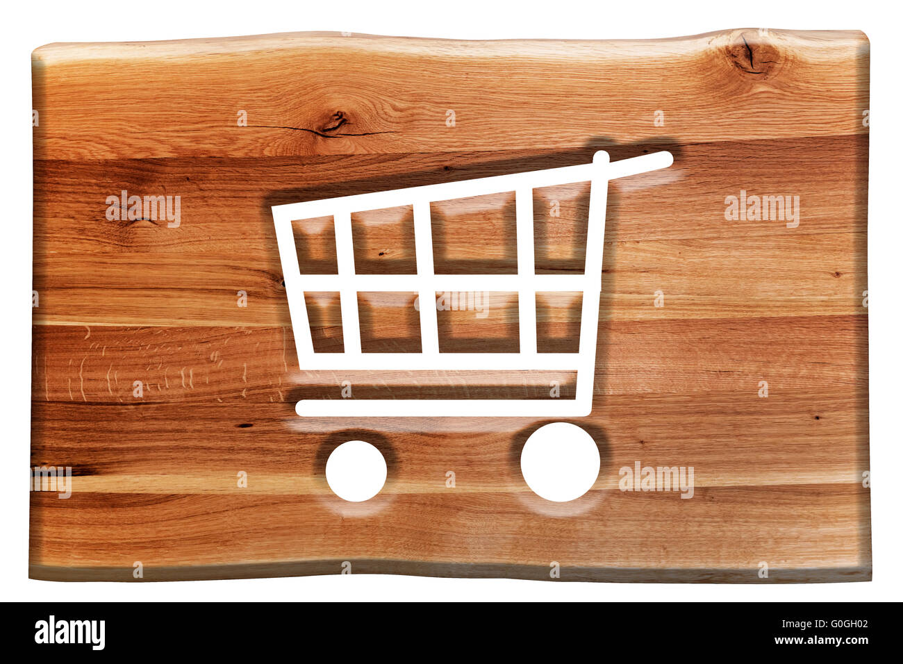 Shopping cart sign, symbol cut in wooden board isolated on white. Stock Photo