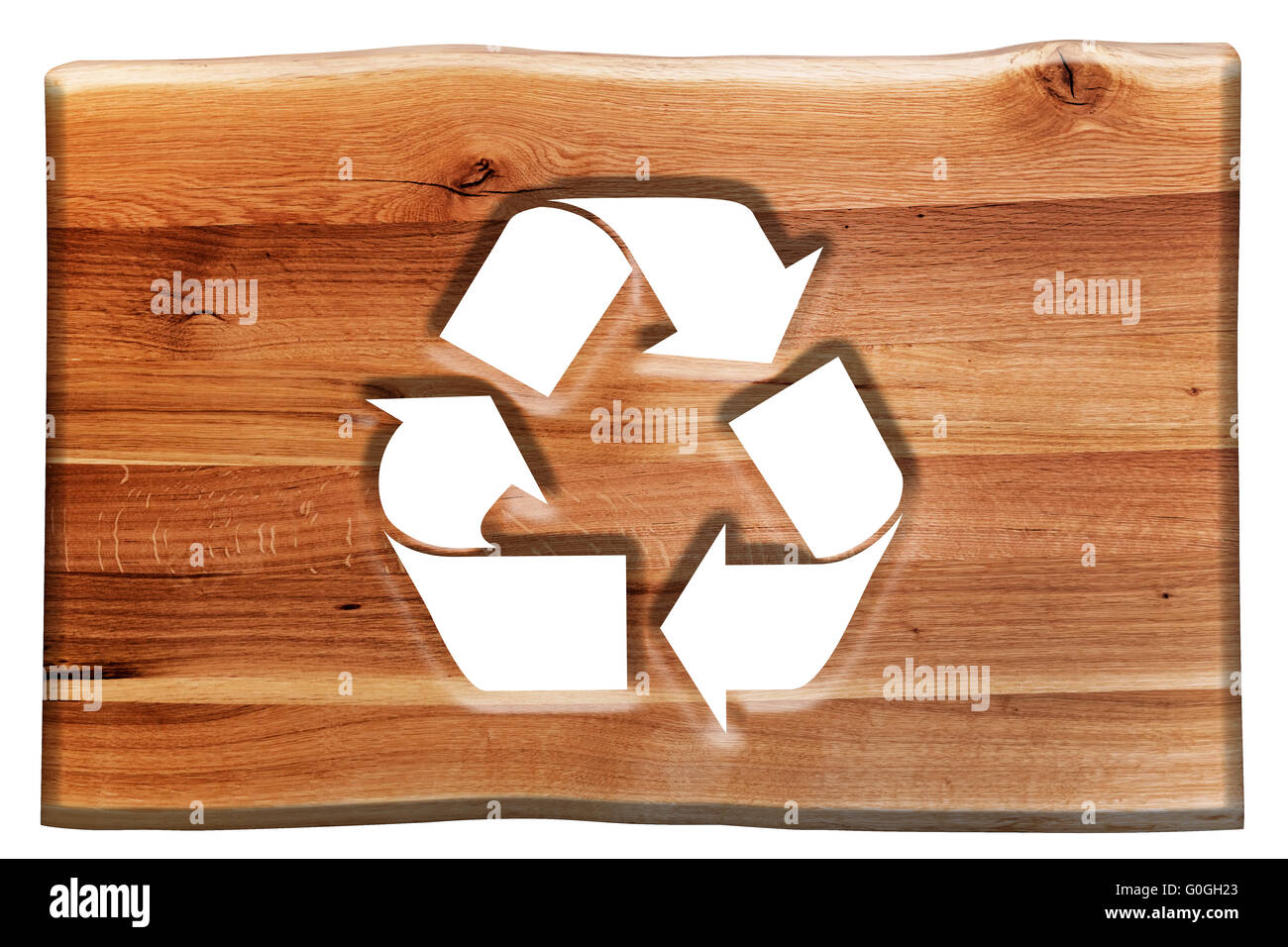Recycling sign, symbol cut in wooden board isolated on white. Stock Photo