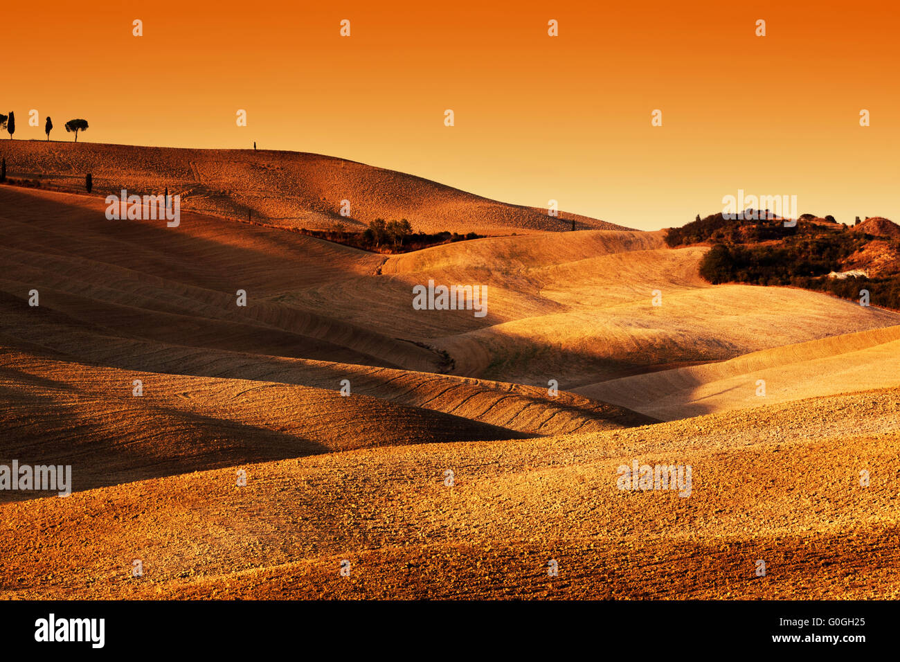 Tuscany, Italy landscape at sunset. Picturesque hills with lights and shadows. Stock Photo