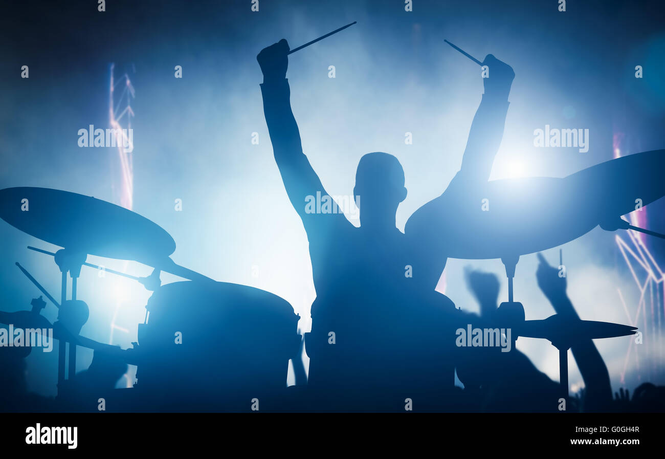 Drummer playing on drums on music concert. Club lights Stock Photo Alamy