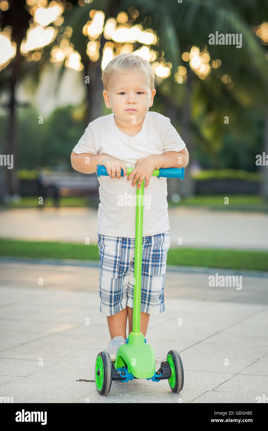 Boy with scooter Stock Photo