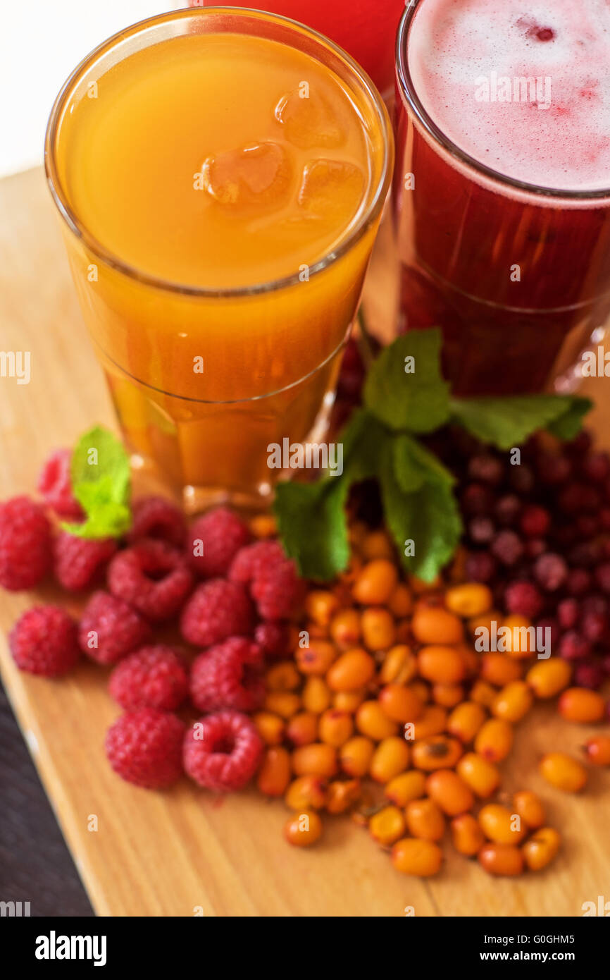 fruit drink with cranberries raspberries and sea buckthorn Stock Photo