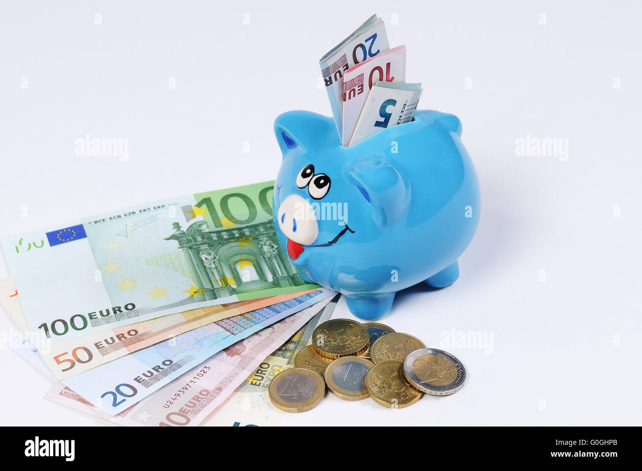 Piggy bank with Euro bills and Euro Coins Stock Photo