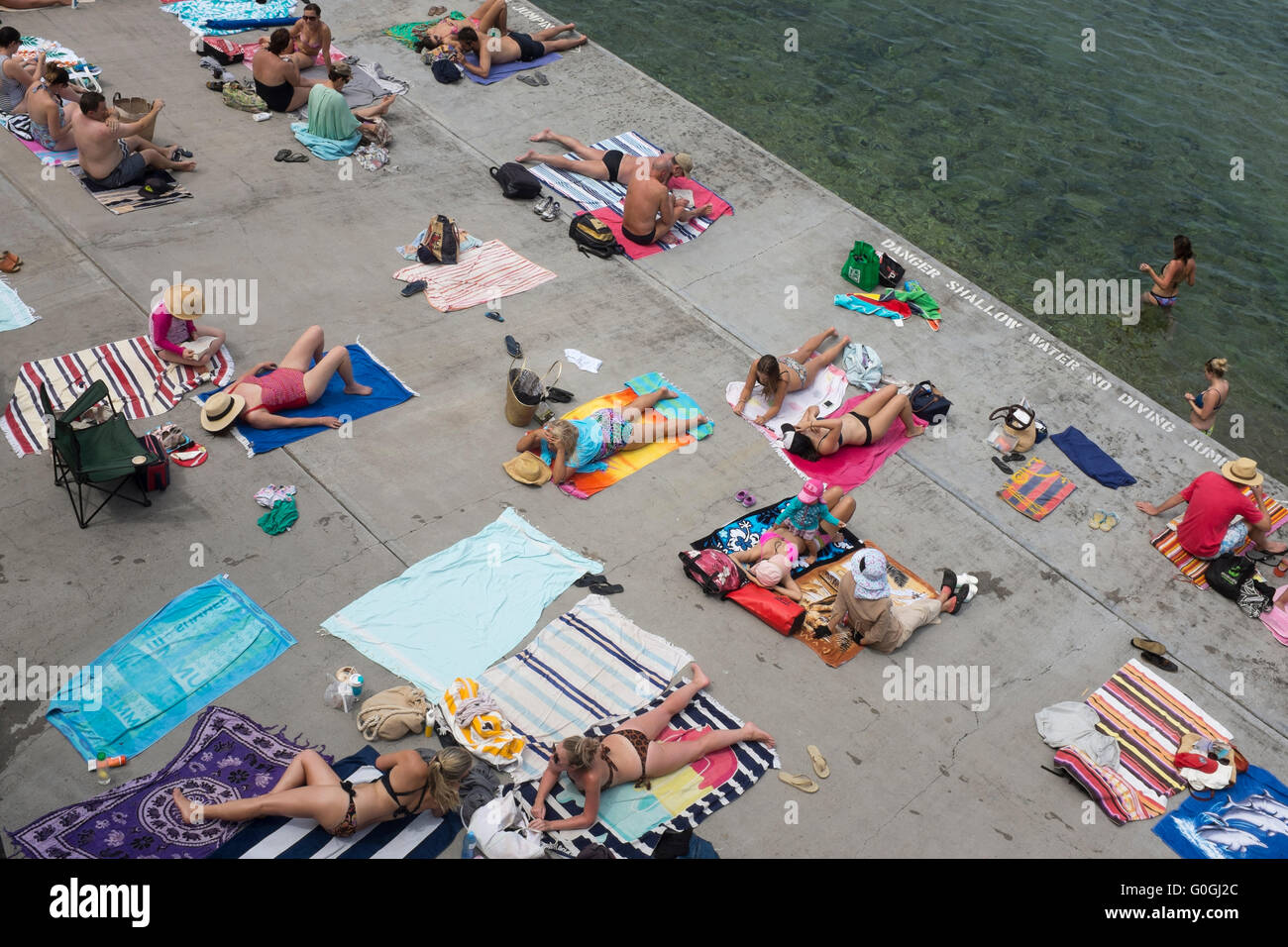 aerial view of sunbathers at Wylie Baths in Sydney, New South Wales, Australia Stock Photo