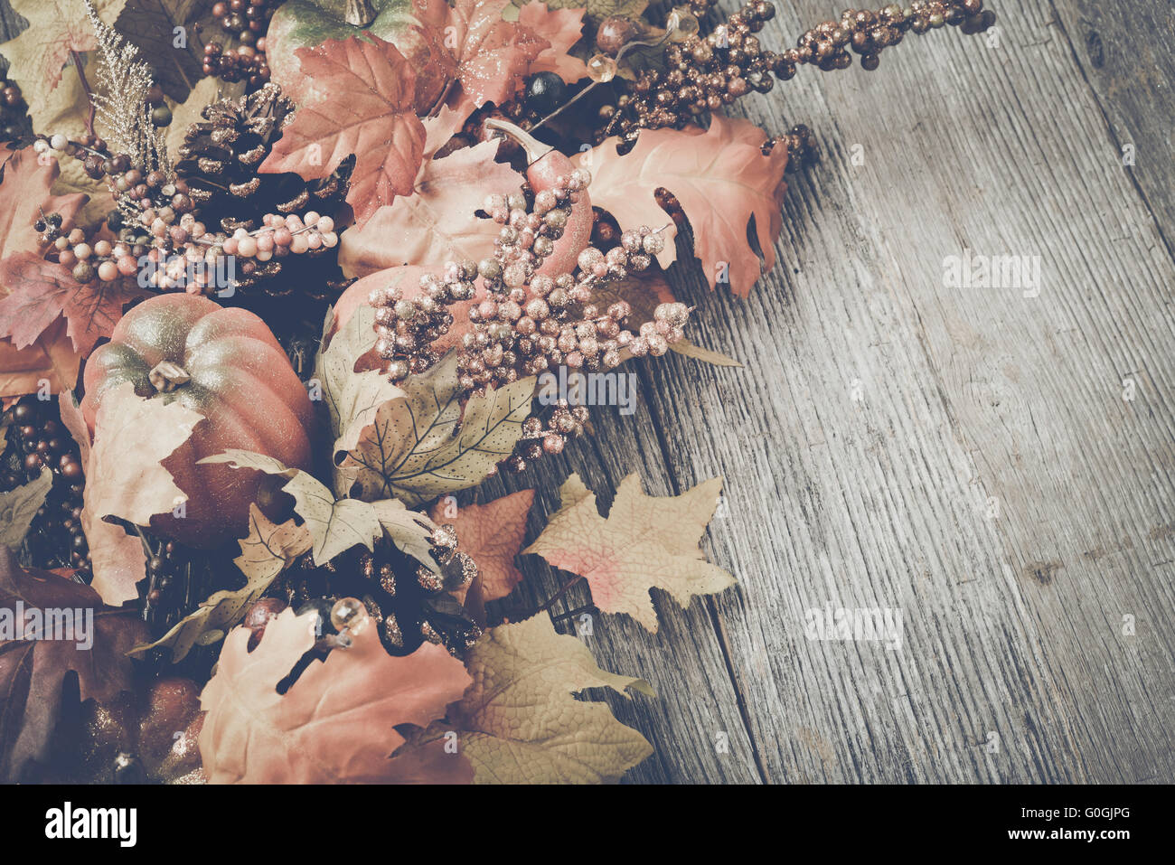 Autumn Leaves on Rustic Wood Background with Instagram Style Filter ...