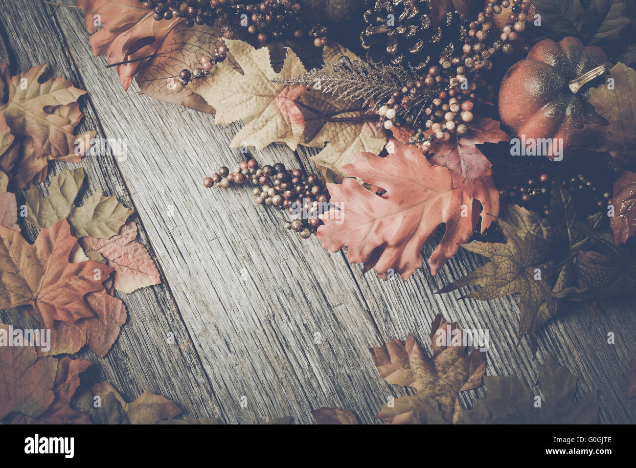 Autumn Leaves on Rustic Wood Background with Instagram Style Filter ...