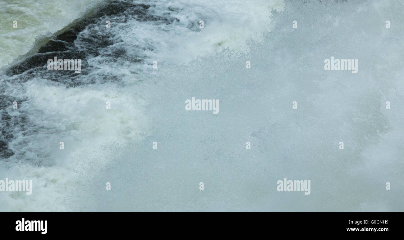 White Shell Rushing River The white rush of water as it flows out of a dam Stock Photo - Alamy