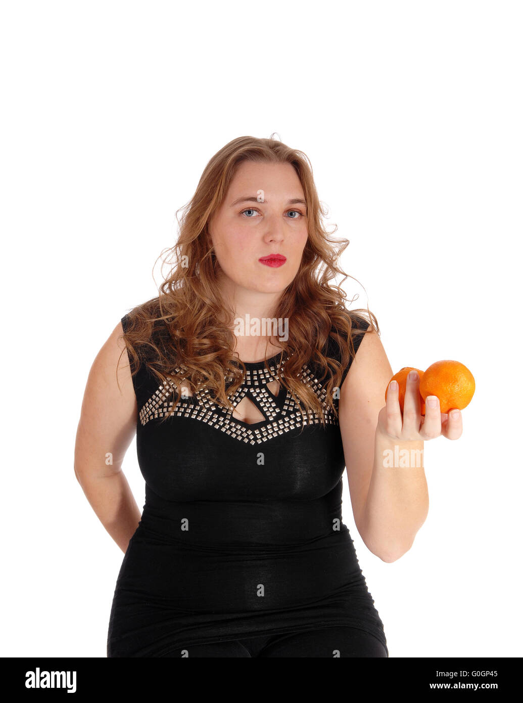Hand holding two oranges hi-res stock photography and images - Alamy