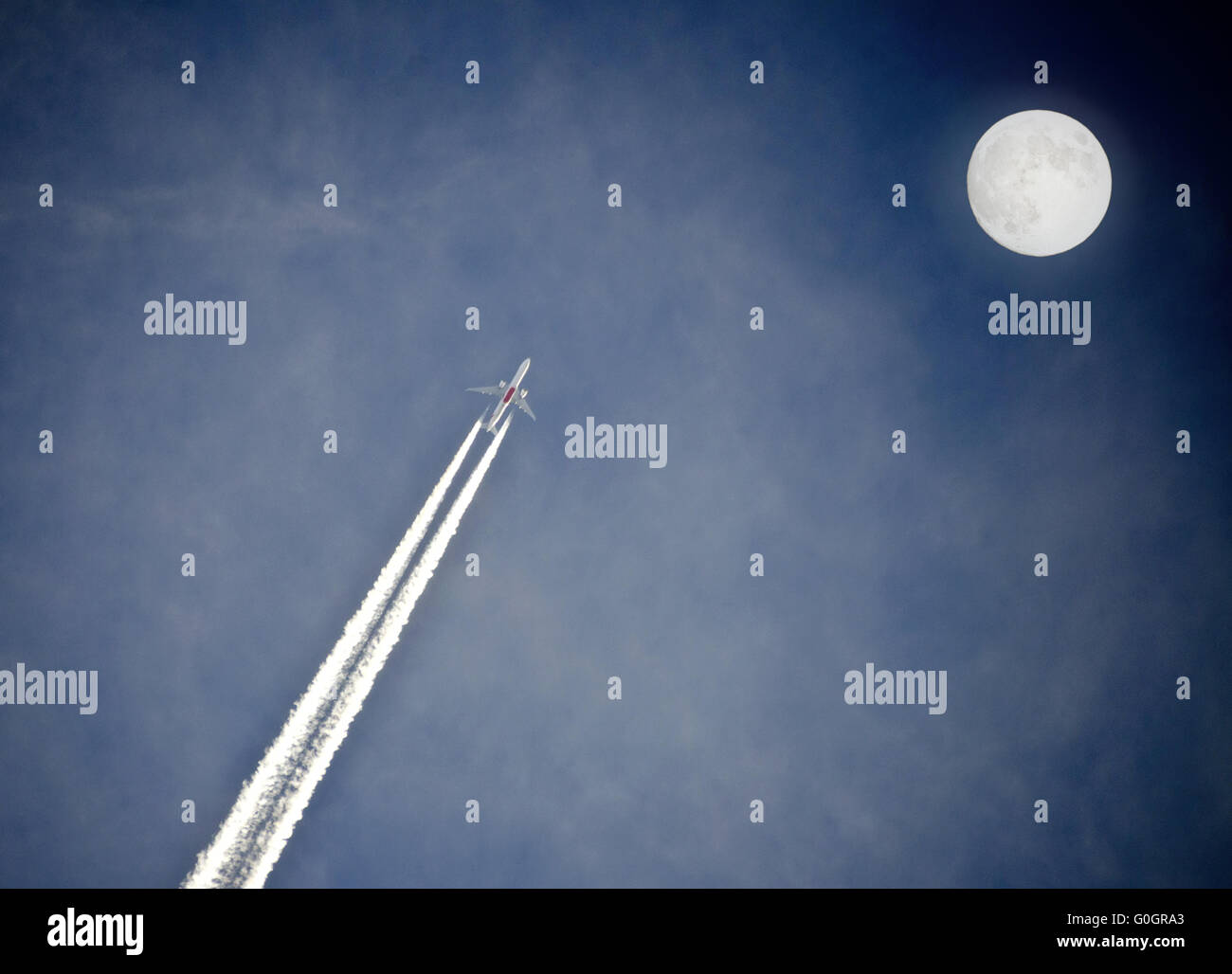 jet flying straight to the full moon Stock Photo - Alamy