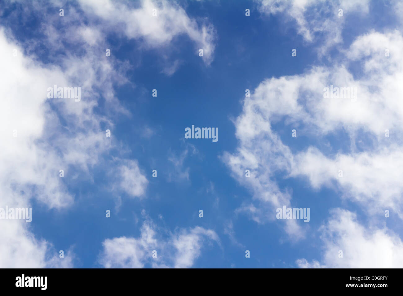 Blue sky and white fluffy clouds Stock Photo - Alamy