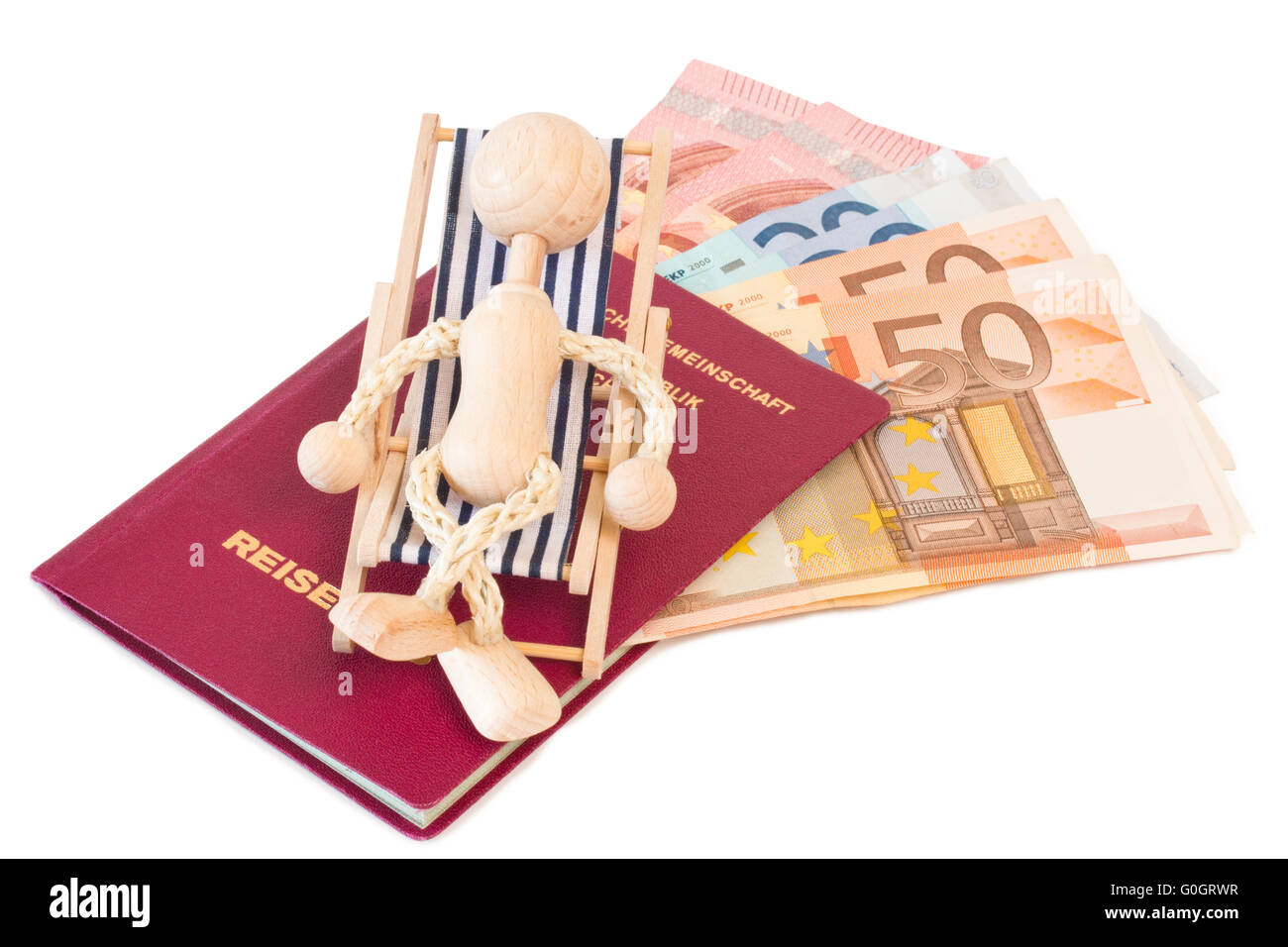 Passport with puppet on a canvas chair and money Stock Photo