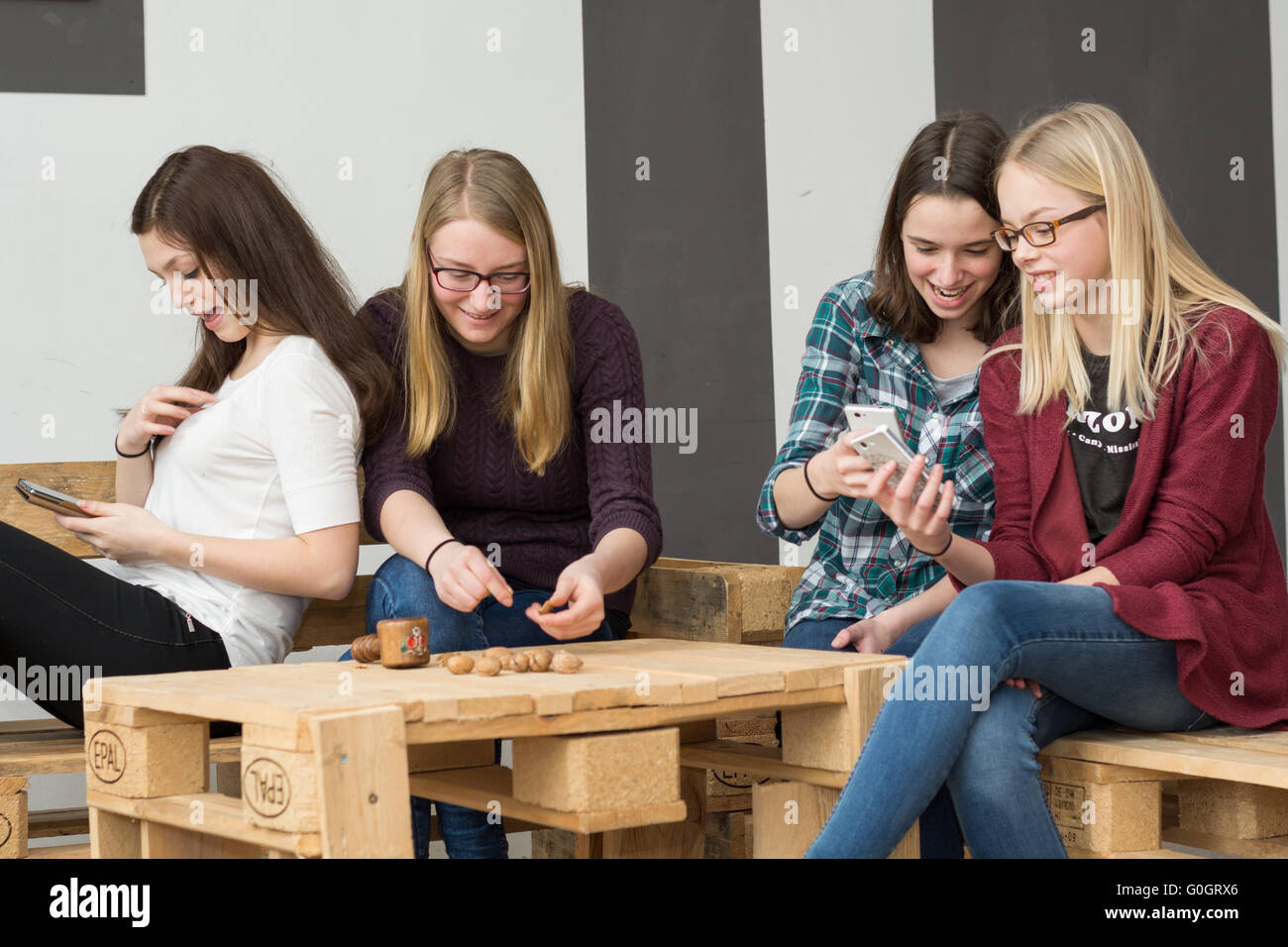 funny teen group with their smartphones Stock Photo