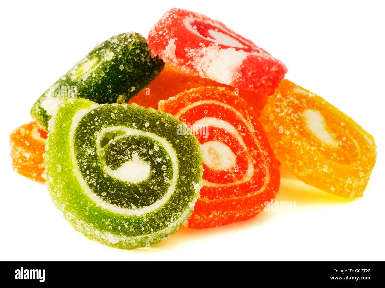 Color fruit jelly in sugar over white background Stock Photo - Alamy