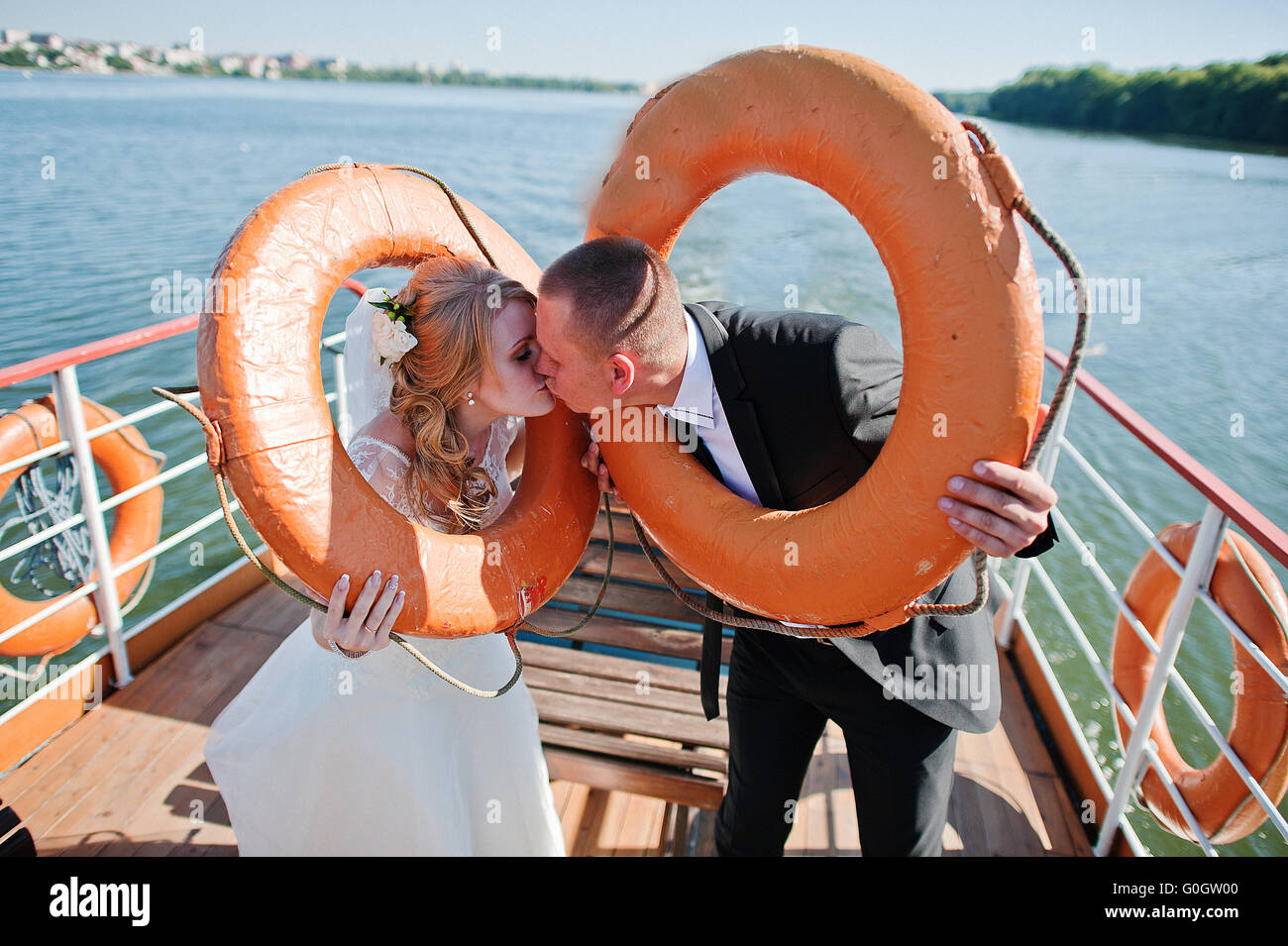 Newlyweds at rescue round Stock Photo - Alamy
