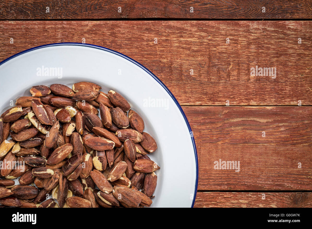 roasted pili nuts grown in Philippines, top view of nuts on white metal