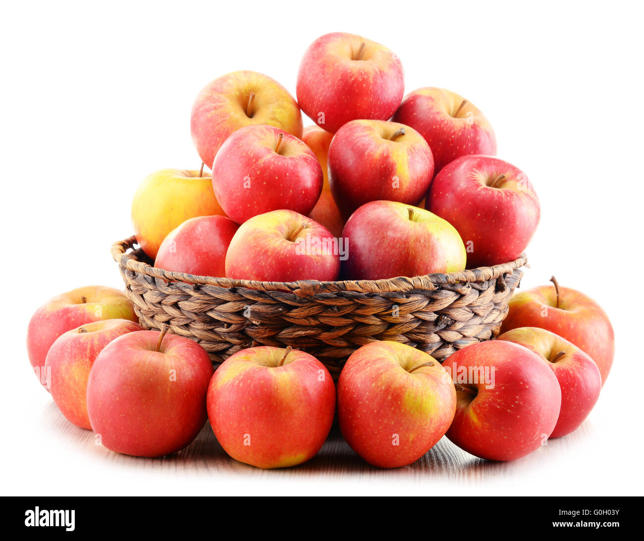 Apples in wicker basket isolated on white background Stock Photo - Alamy