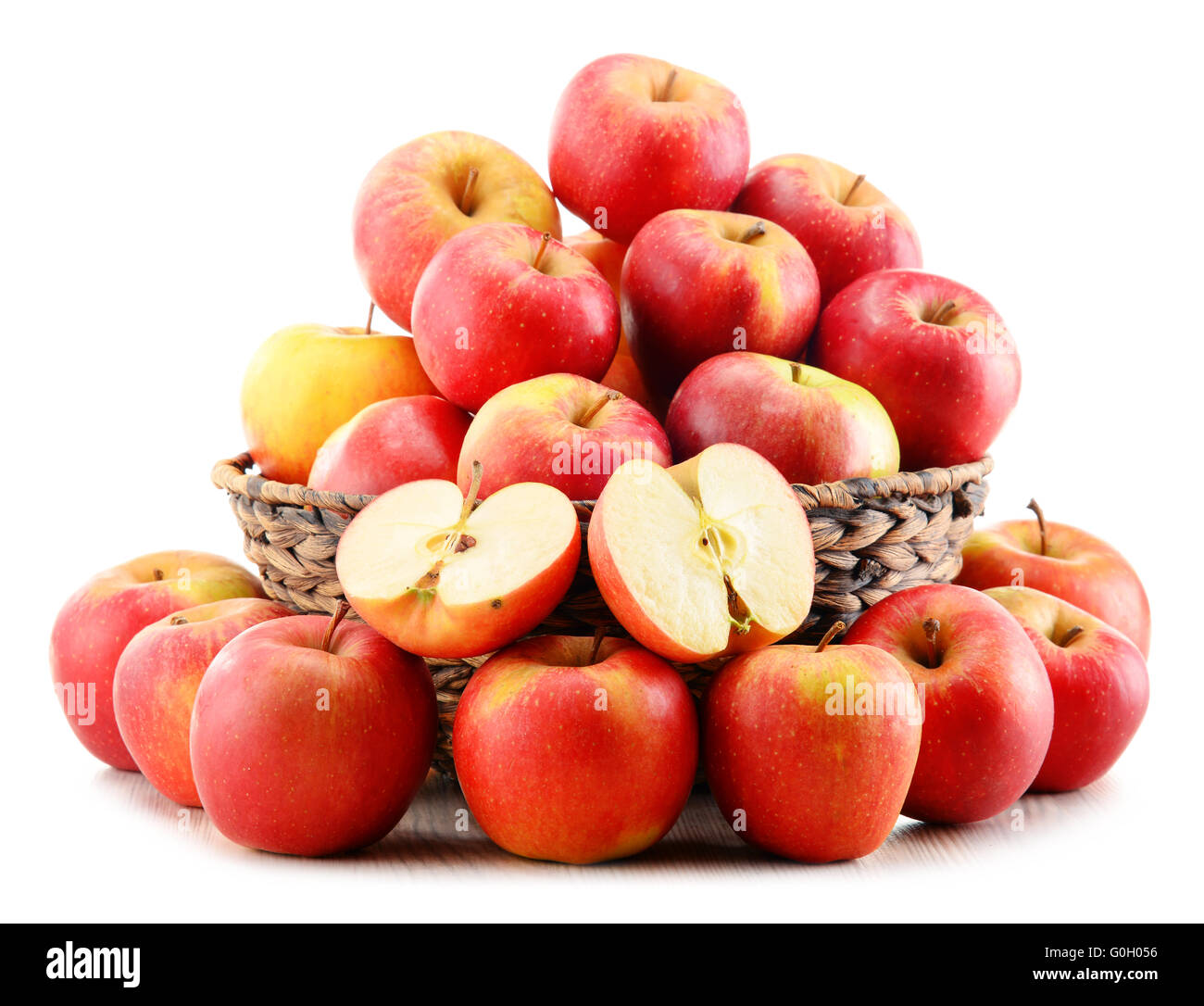 Apples in wicker basket isolated on white background Stock Photo - Alamy
