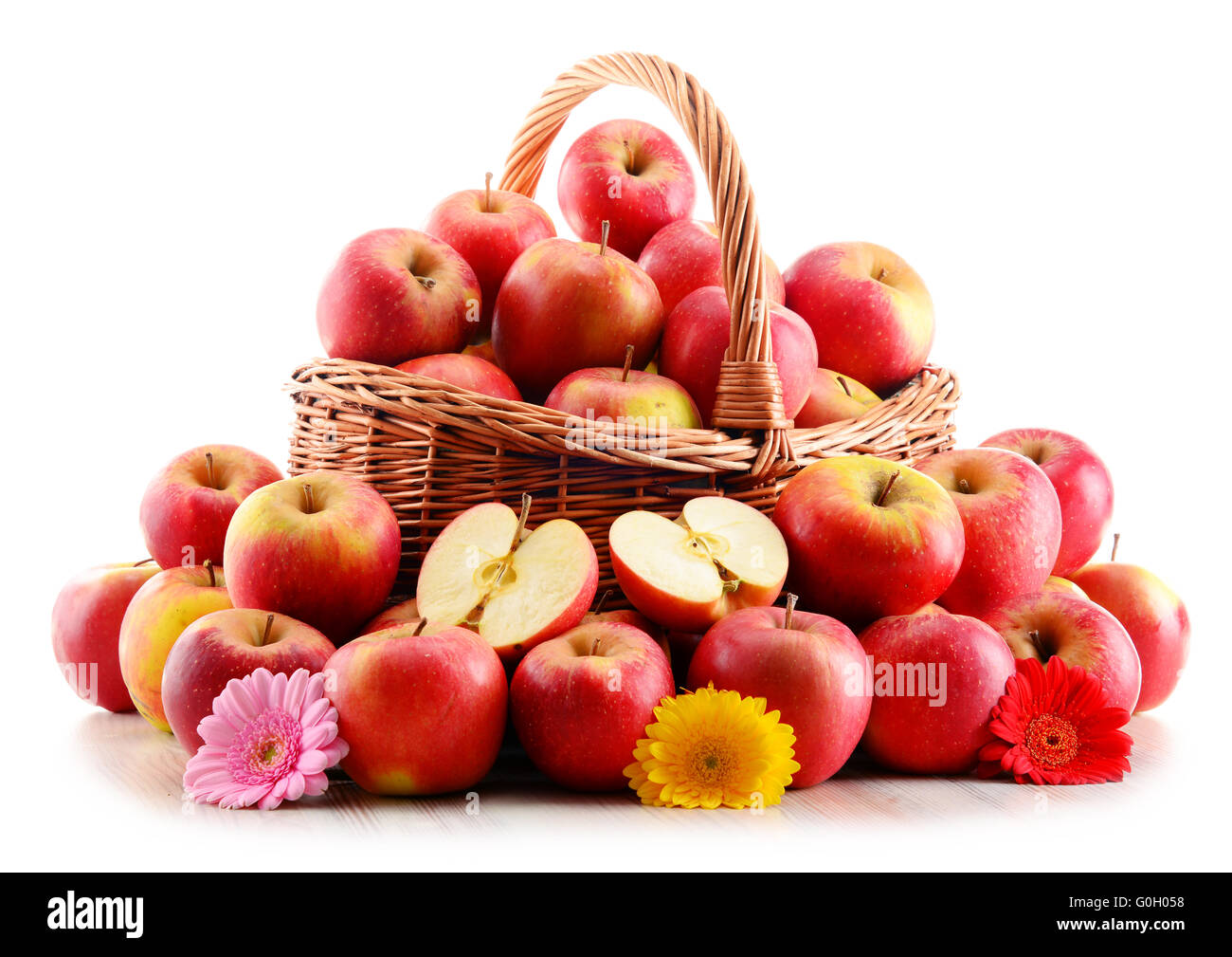 Apples in wicker basket isolated on white background Stock Photo - Alamy