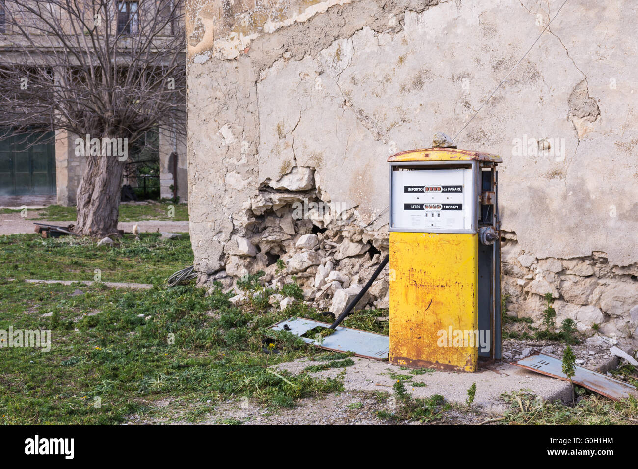 Distributor or gas pump, abandoned. Isolated, old and rusty in a war zone, a symbol of power, the concept of abandonment. Abstra Stock Photo