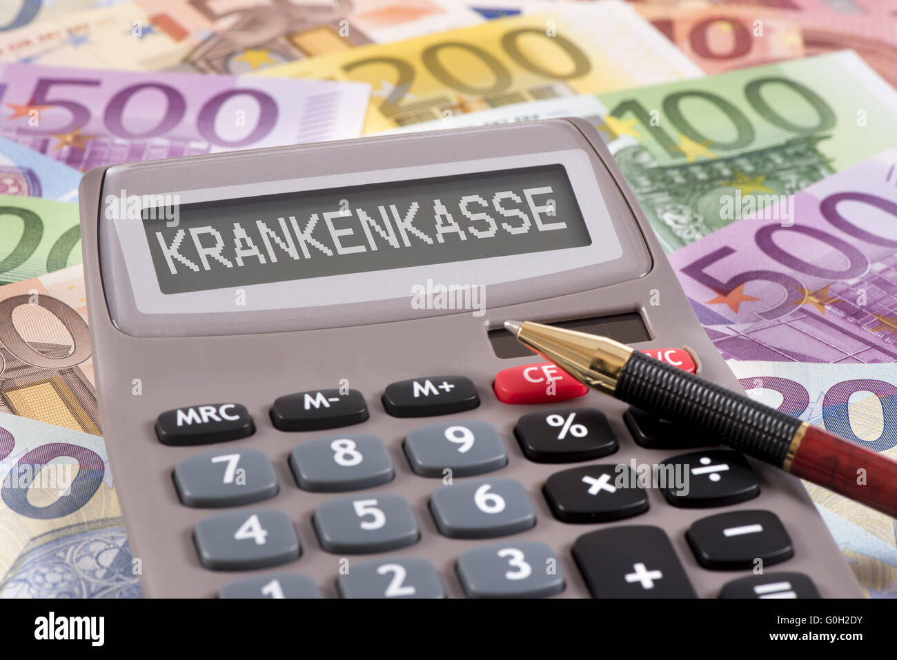 health insurance marked on calculator over euro Stock Photo