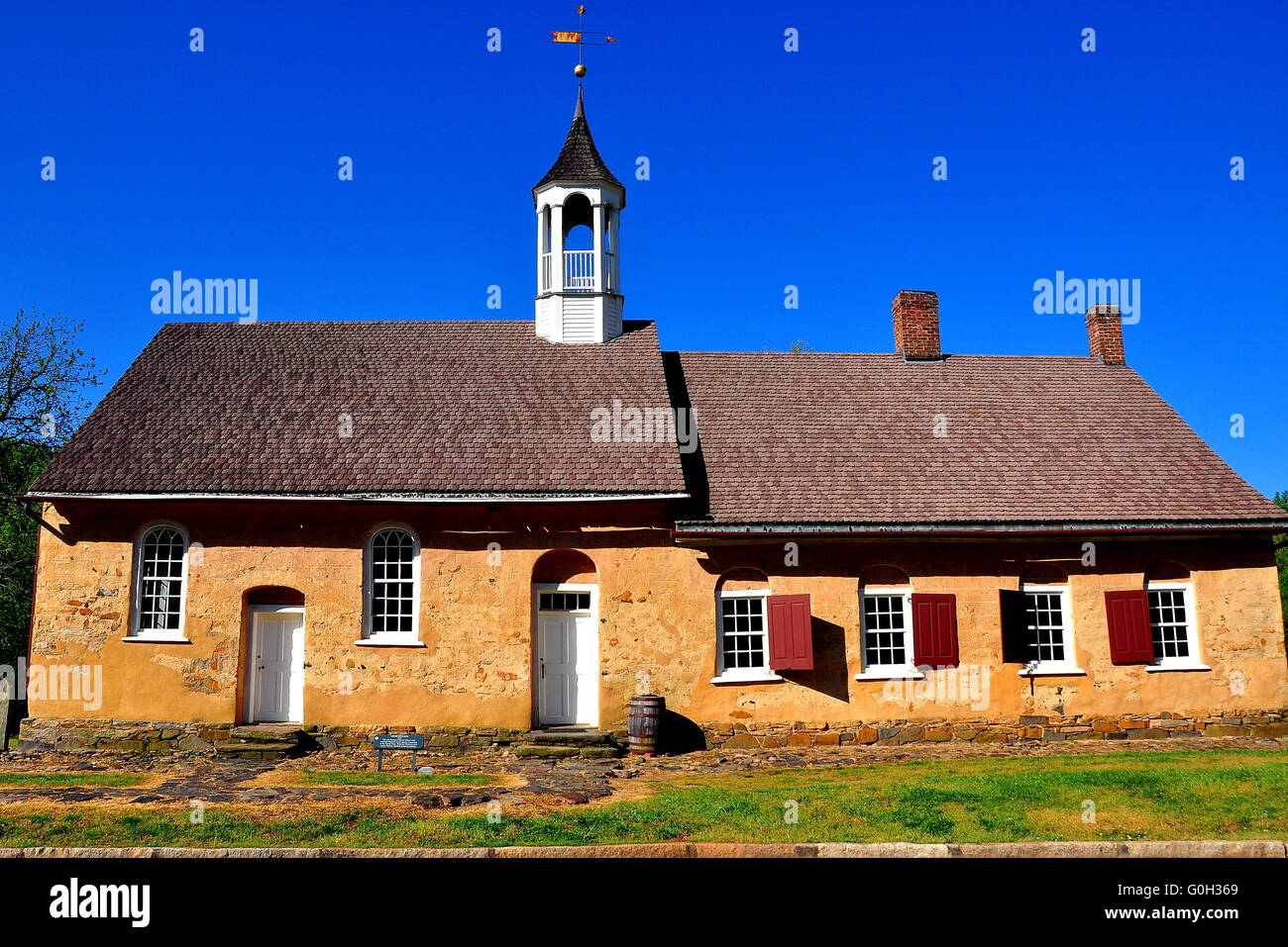 Bethabara, North Carolina:   1788 Gemeinhaus Moravian Church with attached minister's house at Bethabara historic settlement * Stock Photo