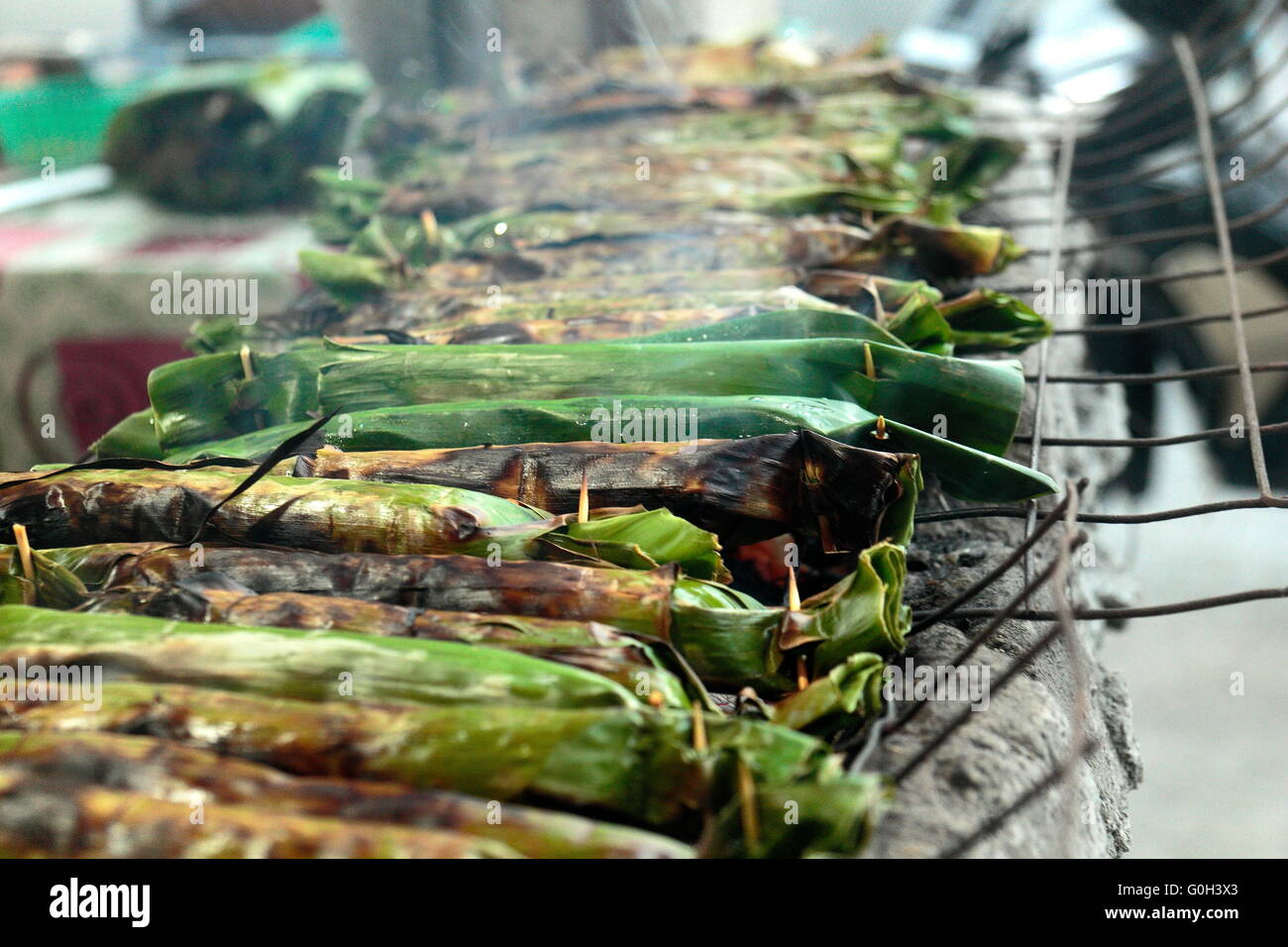 Sticky Rice With Taro Sticky rice with coconut milk, a banana , taro, banana leaves grilled ...