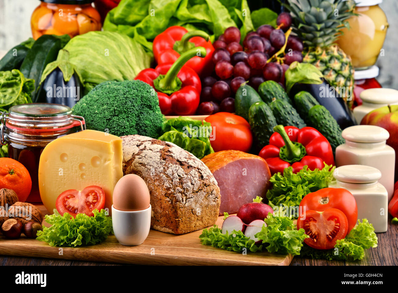 Variety of organic food including vegetables fruit bread dairy and meat