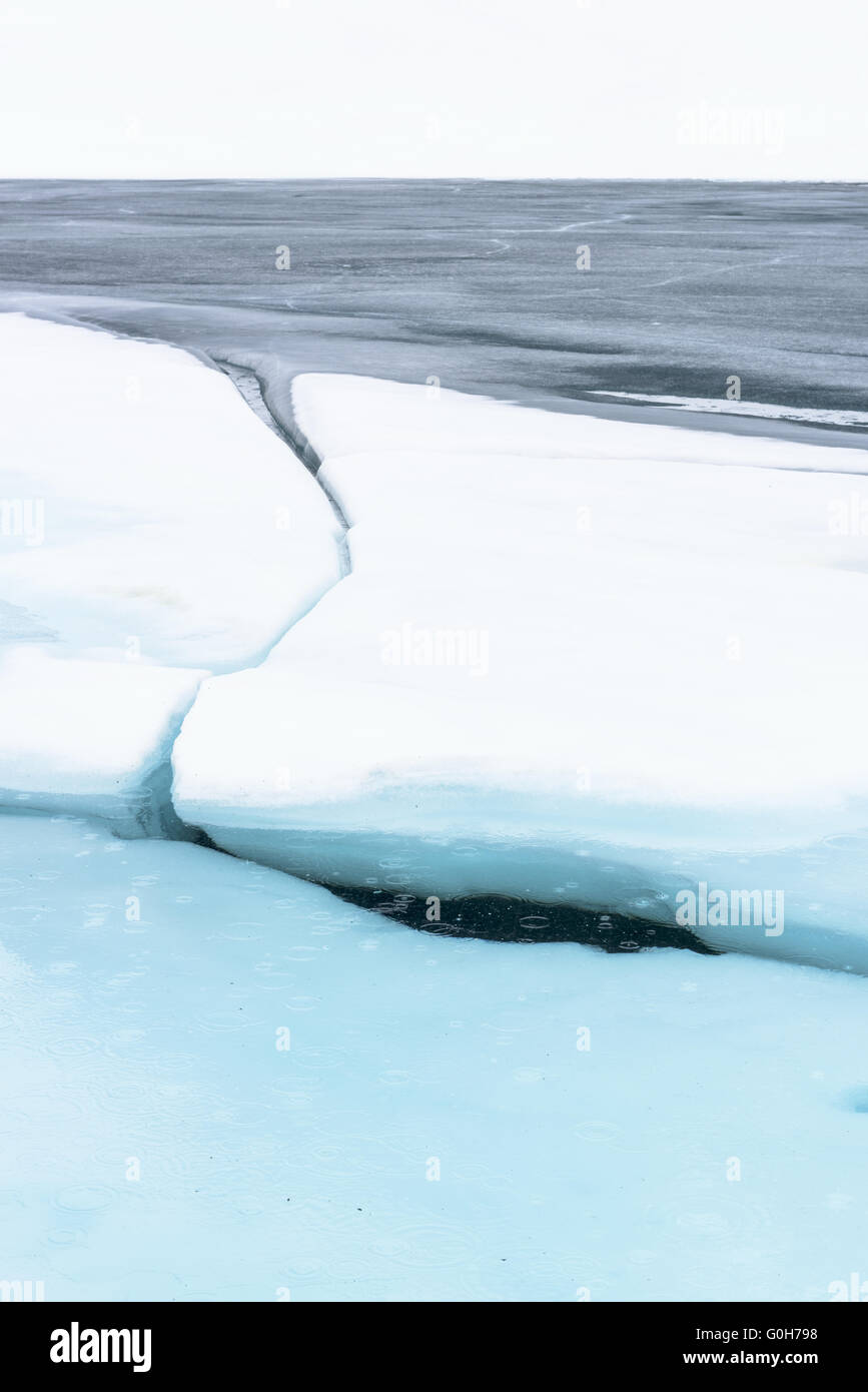 sheets of ice in a mountain lake, Kebnekaise mountains, Lapland, Sweden Stock Photo