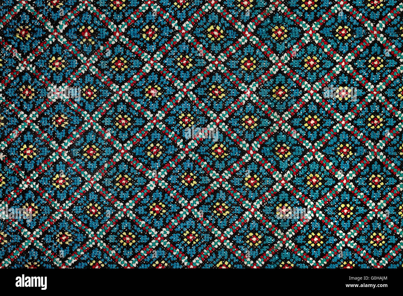 blue embroidered cross-stitch background Ukrainian national pattern