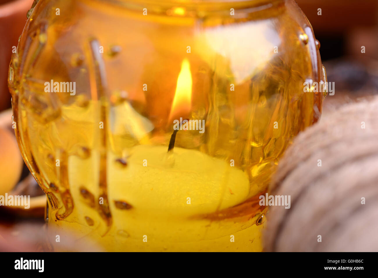 candles in glass burning romantic celecration concept wooden kitchen close up Stock Photo