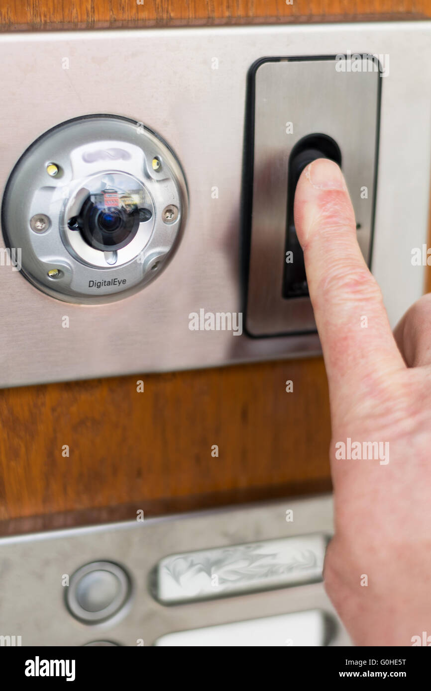 Security system at the front door with fingerprint scanner and camera Stock  Photo - Alamy