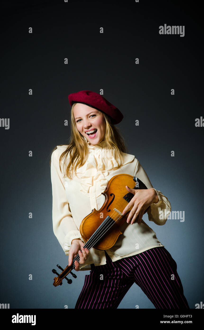 Woman violin player in musical concept Stock Photo - Alamy