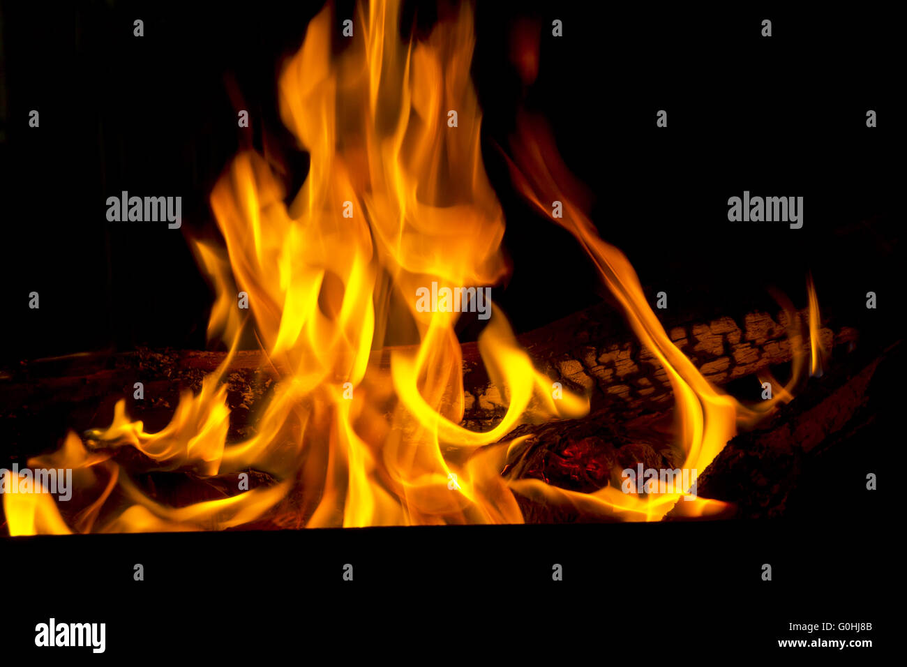 Red fire flame on black background Stock Photo - Alamy